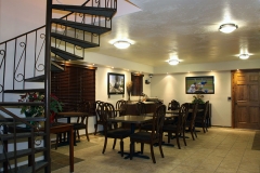 Breakfast Room with Staircase at Clover Creek Inn