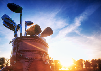 Professional golf gear on the golf course at sunset